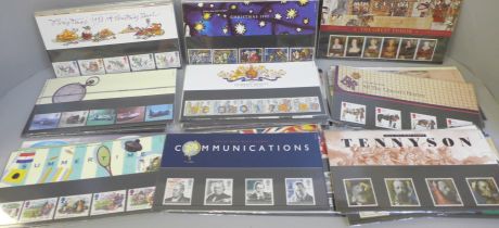 A collection of 56 Royal Mail mint stamp packs