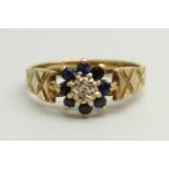 A 9ct gold, blue stone and diamond cluster ring, 2.2g, K