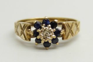 A 9ct gold, blue stone and diamond cluster ring, 2.2g, K