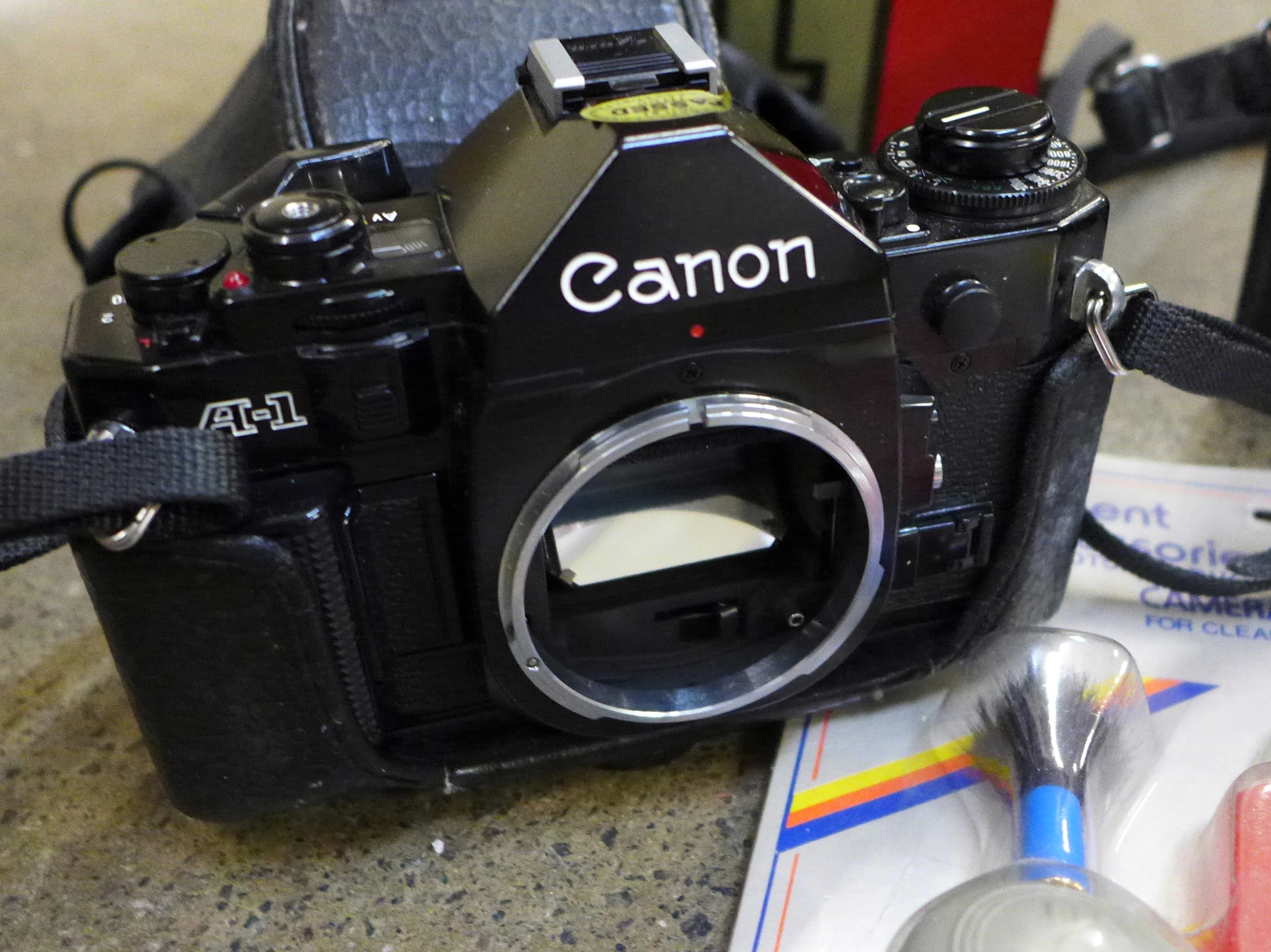 A Canon A-1 35mm SLR camera body, a Canon cine camera, cased and a cleaning kit - Image 2 of 4