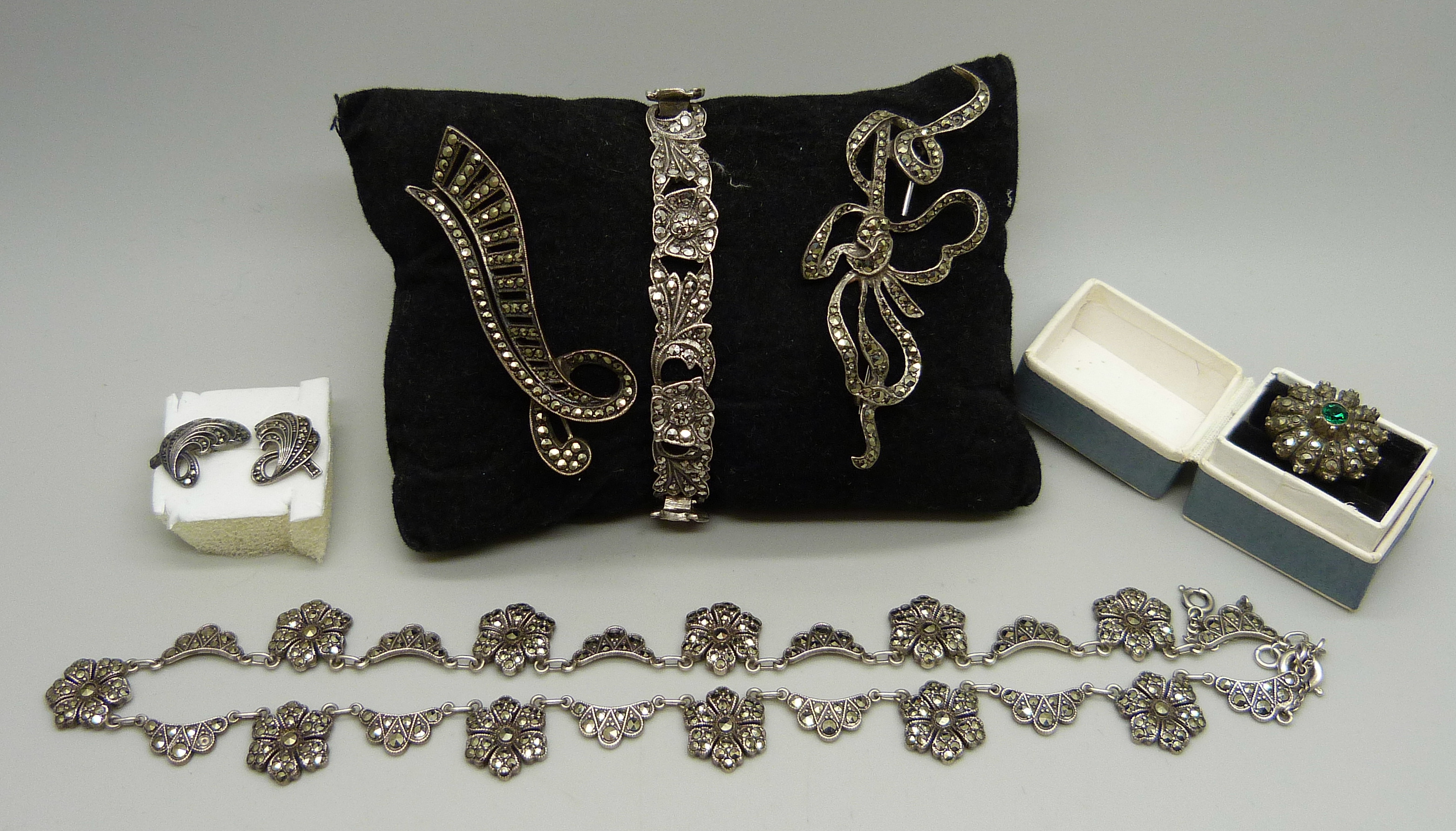 A collection of silver and marcasite jewellery; a necklace (missing one stone), a .800 ring, two