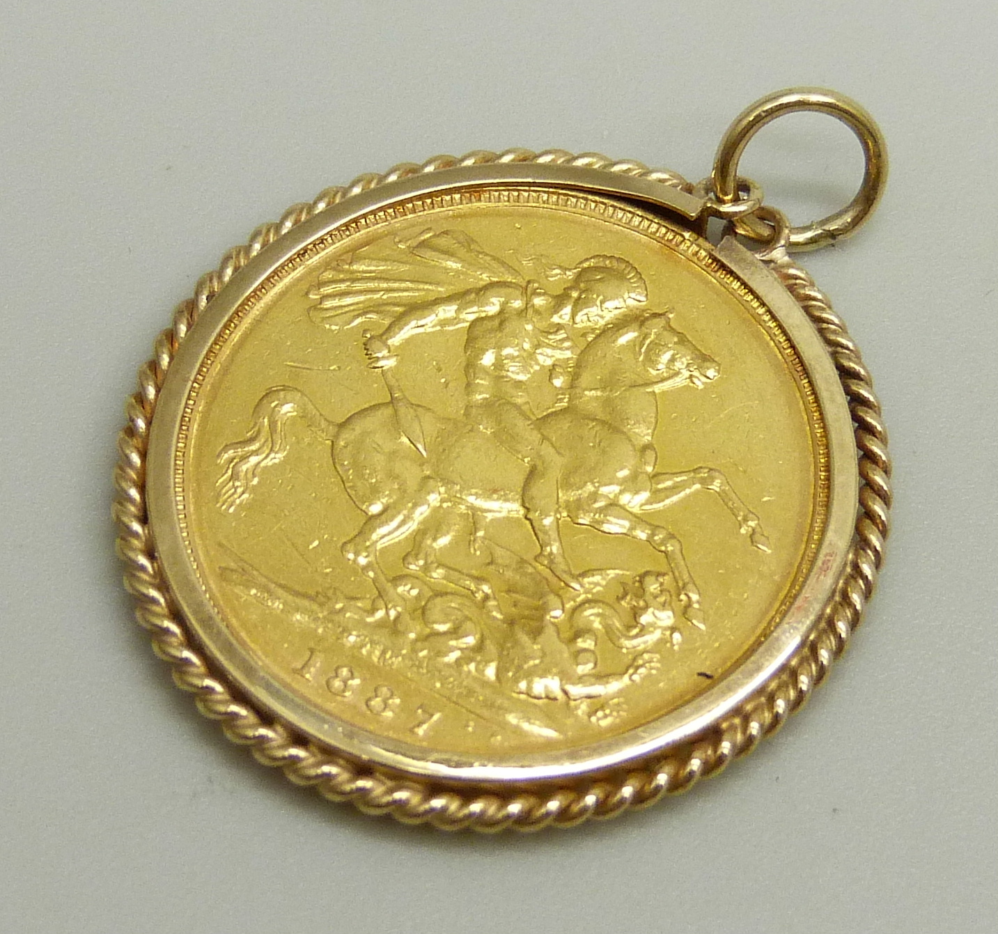 An 1887 full sovereign in a yellow metal pendant mount, 9.4g