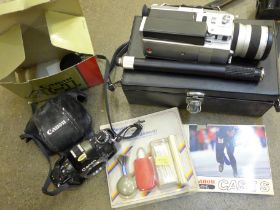 A Canon A-1 35mm SLR camera body, a Canon cine camera, cased and a cleaning kit