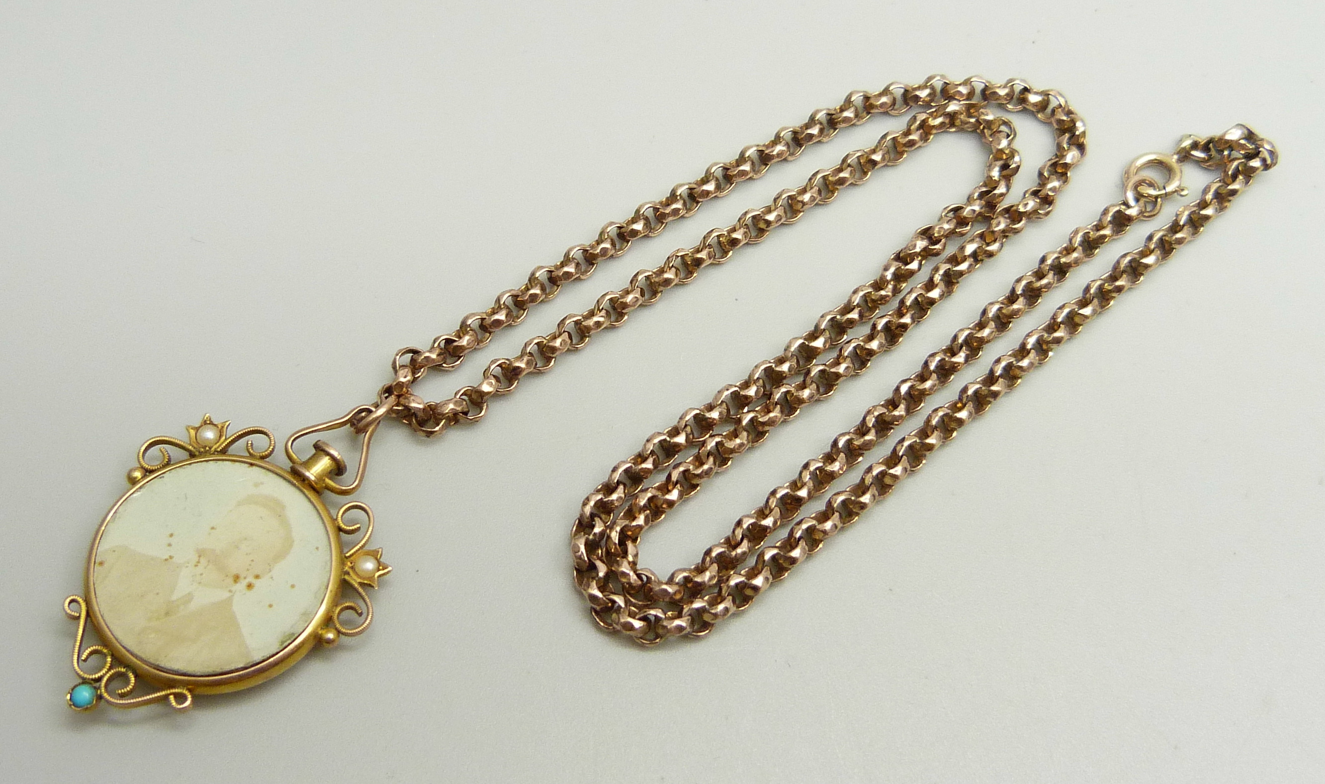 A Victorian 9ct gold photograph pendant set with turquoise and seed pearls with 9ct plaque verso,