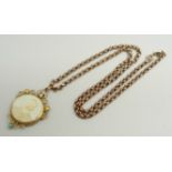 A Victorian 9ct gold photograph pendant set with turquoise and seed pearls with 9ct plaque verso,