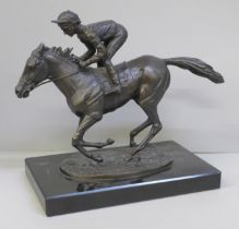 A bronze model of Lester Piggott on Nijinsky, modelled by David Cornell, 1985 on a black marble