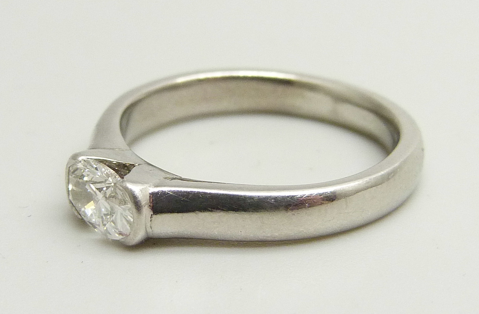 A platinum and diamond solitaire ring, approximately 0.5ct diamond weight, 6.7g, M - Image 2 of 4