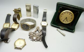 An 8 day travel clock, wristwatches, lighters and a Masonic medal, inscribed 'Presented to the lodge