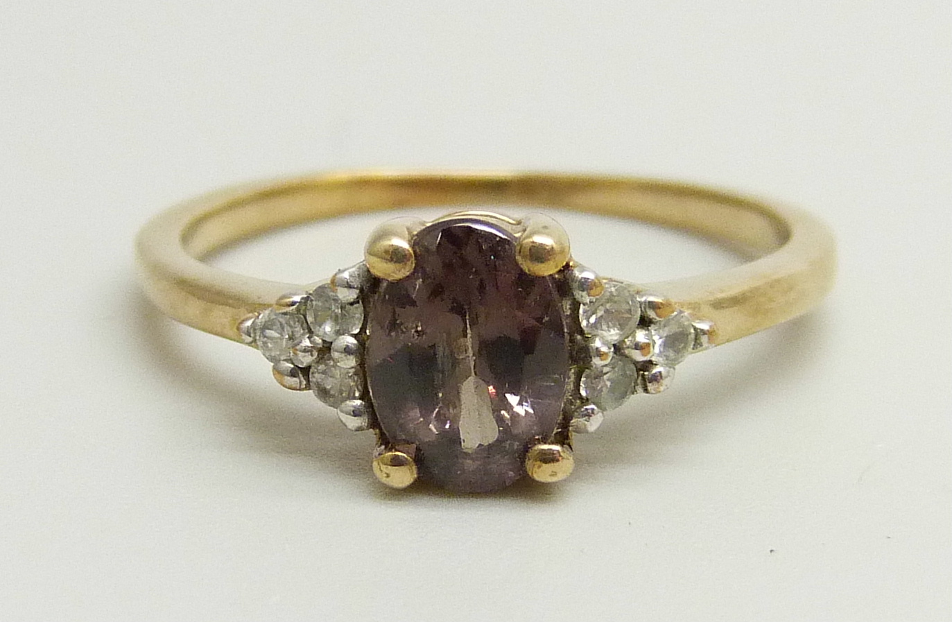 A 9ct gold, colour change garnet and white spinel ring, 2g, L