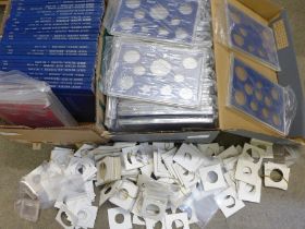 Coin collector's items; a large collection of plastic packs for coin sets, (mounts), other empty
