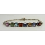 A white metal bracelet set with eight multi-coloured stones, 8g, 16.5cm long