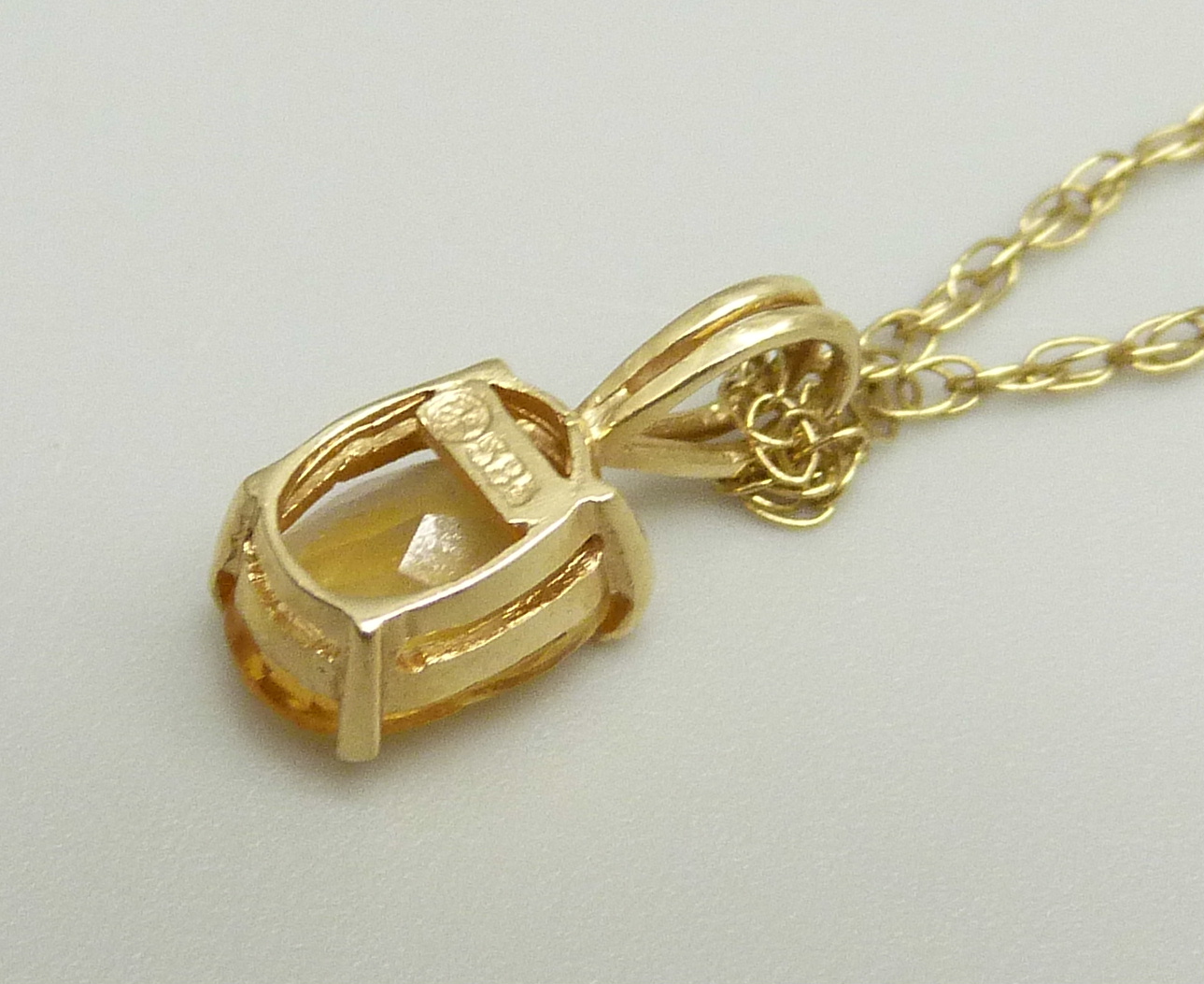 A 14ct gold pendant set with a citrine on a fine 9k gold chain, chain approximately 47cm, pendant - Image 3 of 3