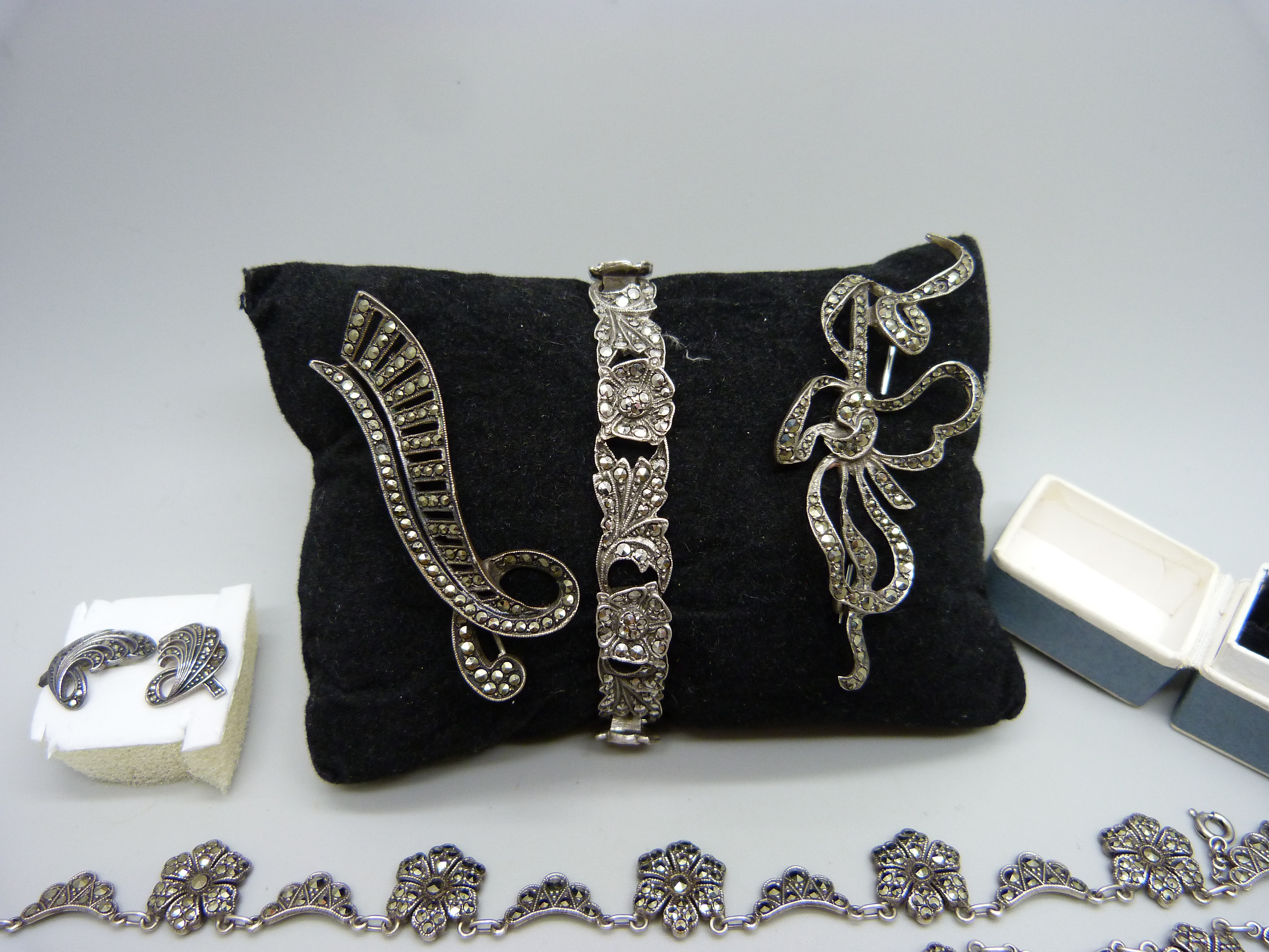 A collection of silver and marcasite jewellery; a necklace (missing one stone), a .800 ring, two - Image 2 of 4