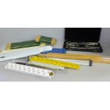 A Lee Guinness technical drawing set, slide rules and rulers, etc.