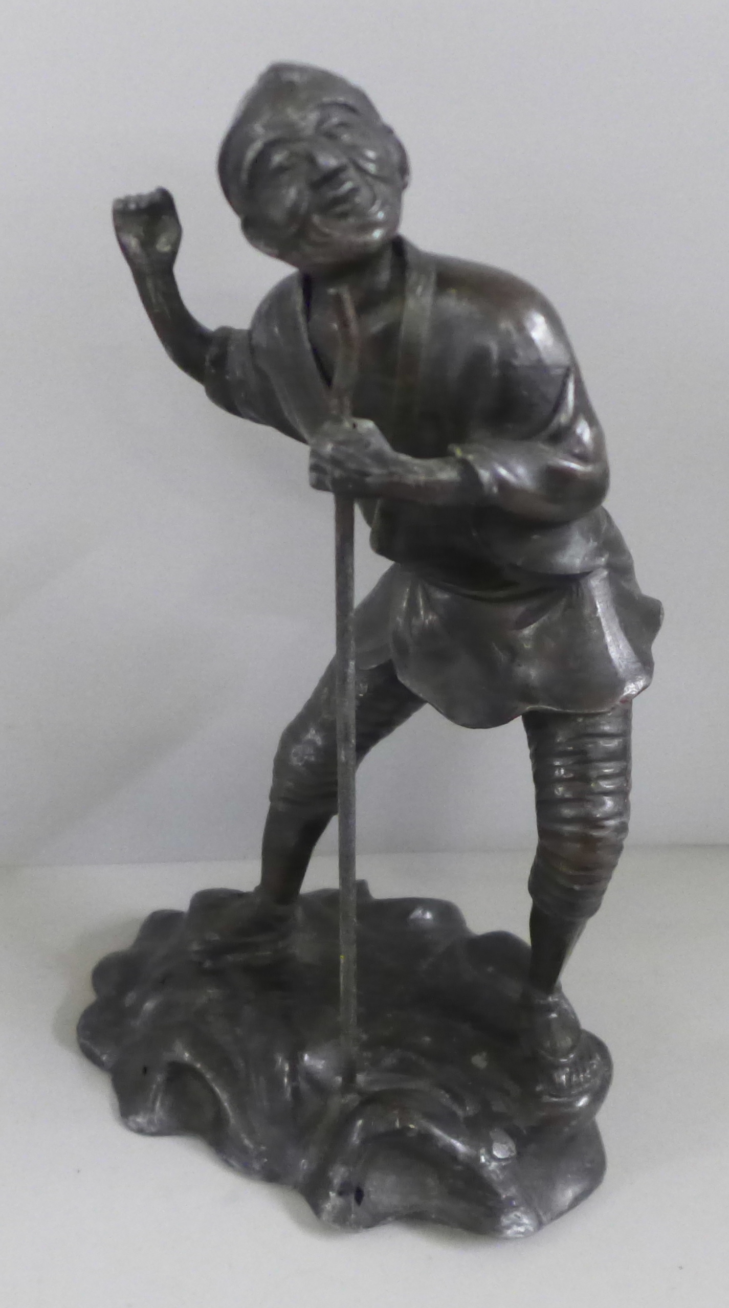 A Chinese spelter figure of an elder, 27cm