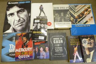 Eleven music books including Bob Dylan, Queen, The Beatles, etc.