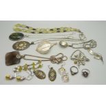 A collection of silver jewellery including two filigree pendants, a citrine bead necklace and