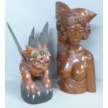 A carved wooden bust of a South East Asian girl and a Chinese painted carving of a dragon