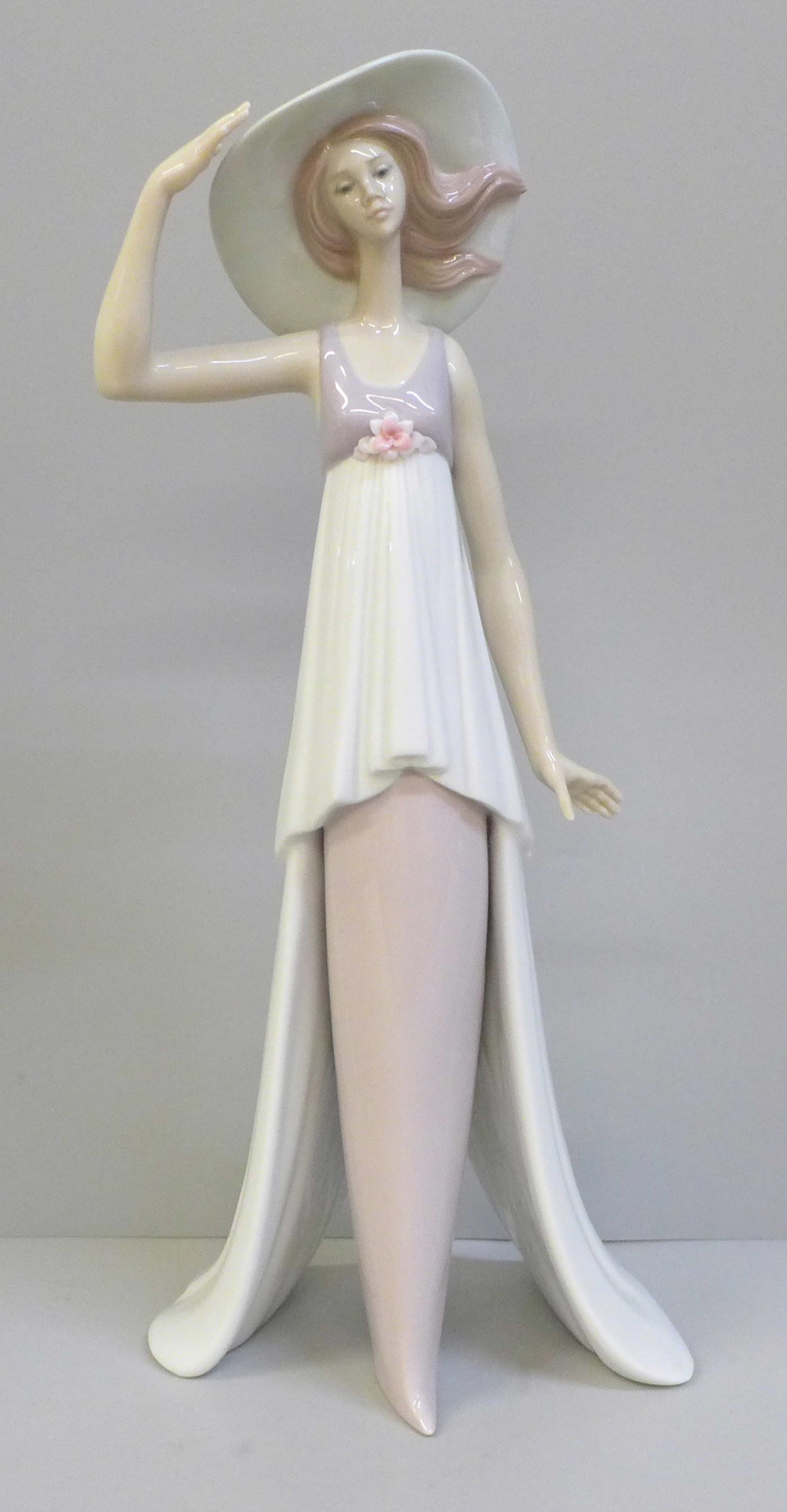A Lladro figure of a girl wearing a sun hat, 6236 backstamp, 35.5cm