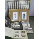 A box of mixed postcards, two albums of cigarette cards and photographs, framed prints of soldiers