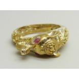 A silver gilt ring in the form of an elephant, set with red spinel eyes, P