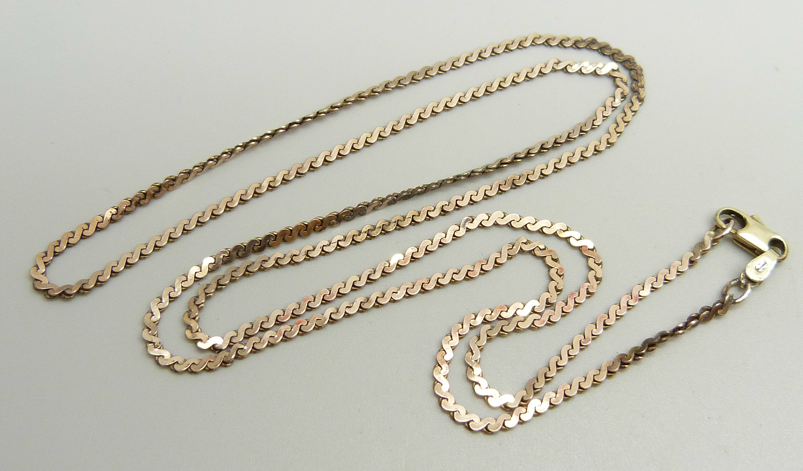 A yellow metal necklace, the chain rose gold with a yellow gold replacement clasp marked 14k, 64.