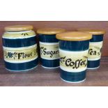 Four Tony Raymond storage jars