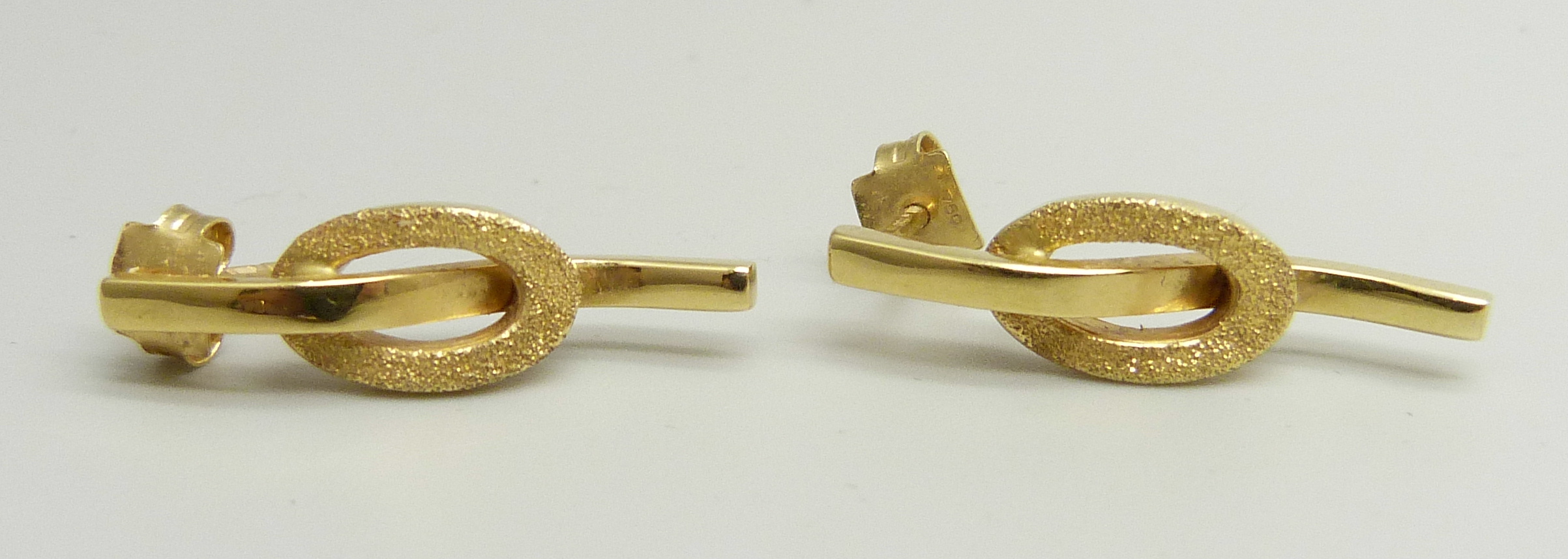 A pair of 18ct gold earrings, marked 750 on posts, 3.9g