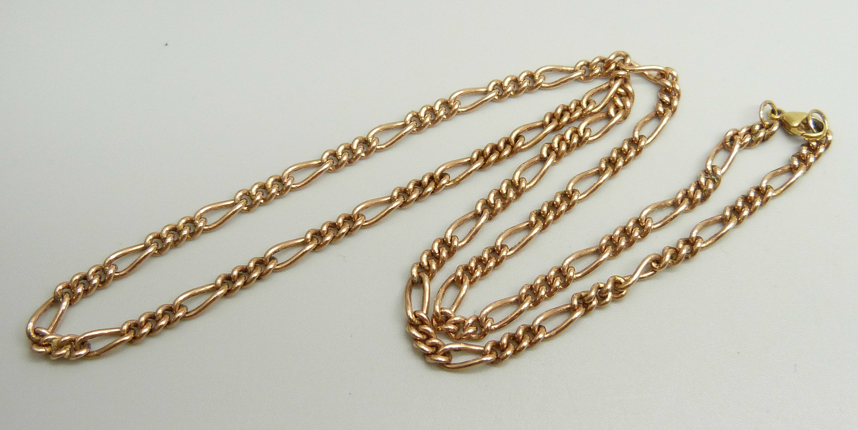 A yellow metal figaro chain necklace, approximately 46.5cm, chain is rose gold with a replacement