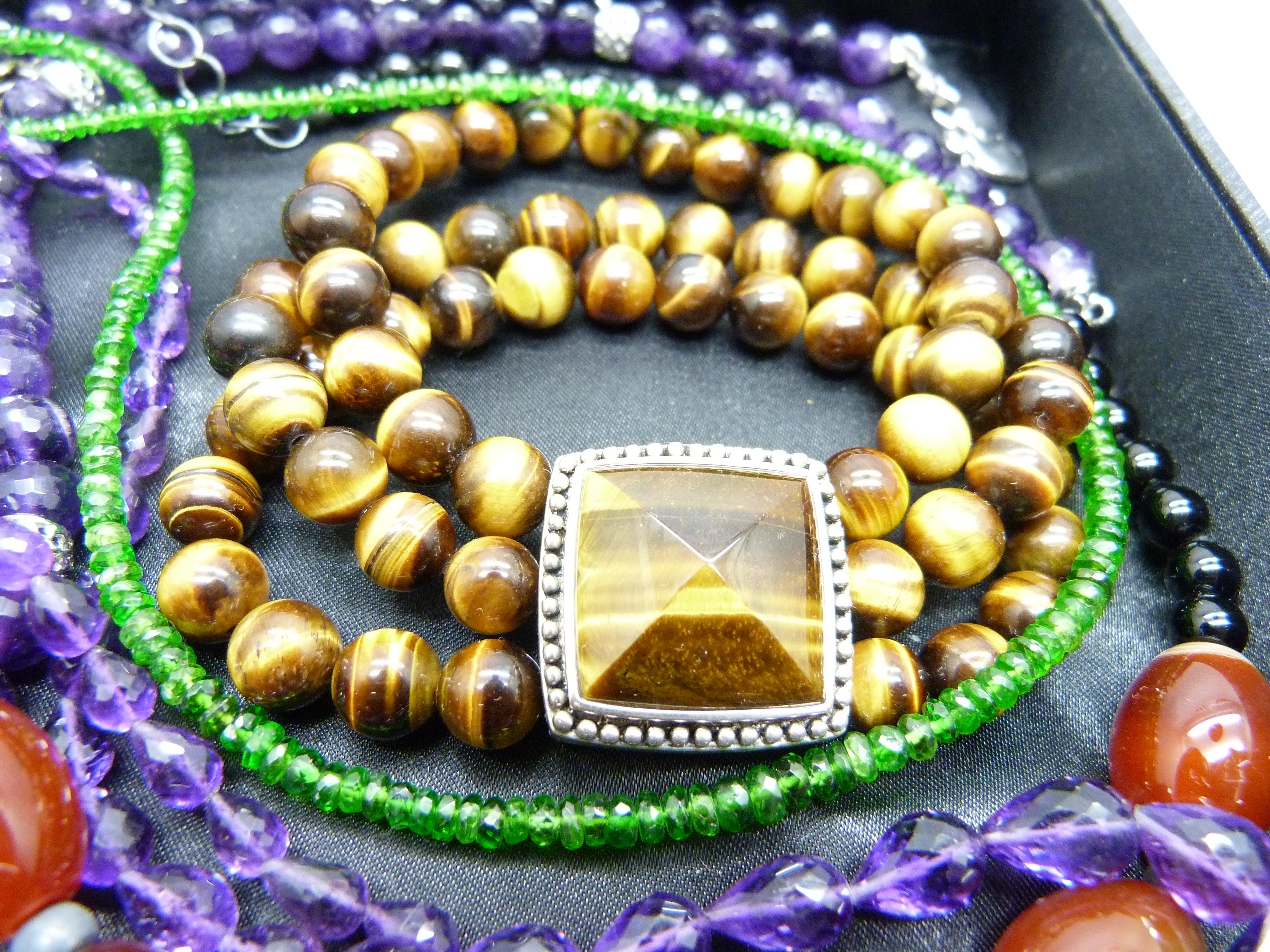 A silver and tiger's eye bracelet, a silver watch on a silver mounted amethyst chain, three other - Image 2 of 3