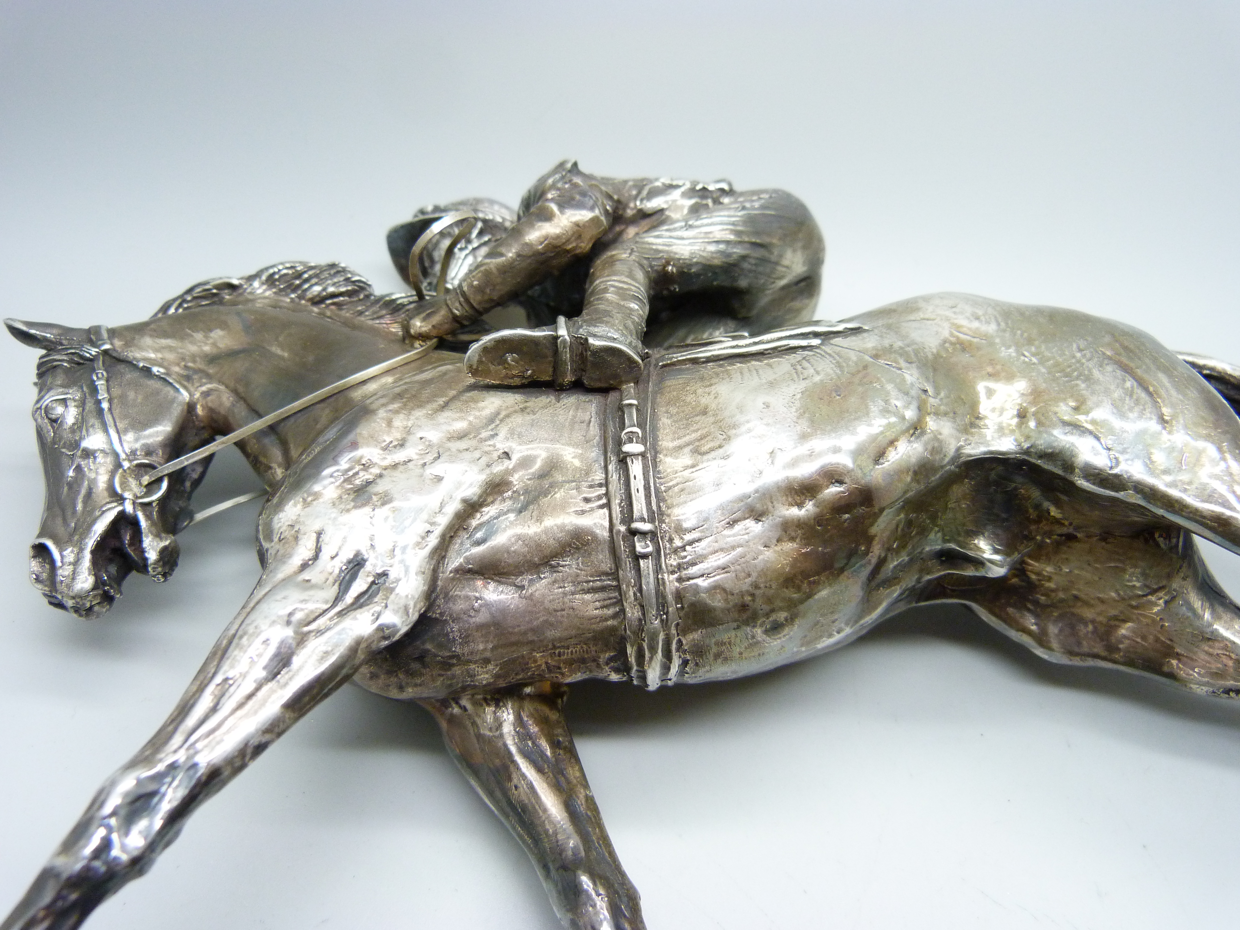 A hallmarked silver model of a racehorse and jockey, resin filled, Sheffield 1997, base 26.5cm x 6. - Image 6 of 6