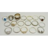 Ten silver rings, 35g, together with eight other plated and white metal rings