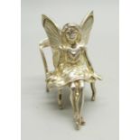 A miniature silver fairy with chair, 3.6cm tall, 17g