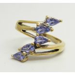 A silver gilt, five stone tanzanite bypass ring, N