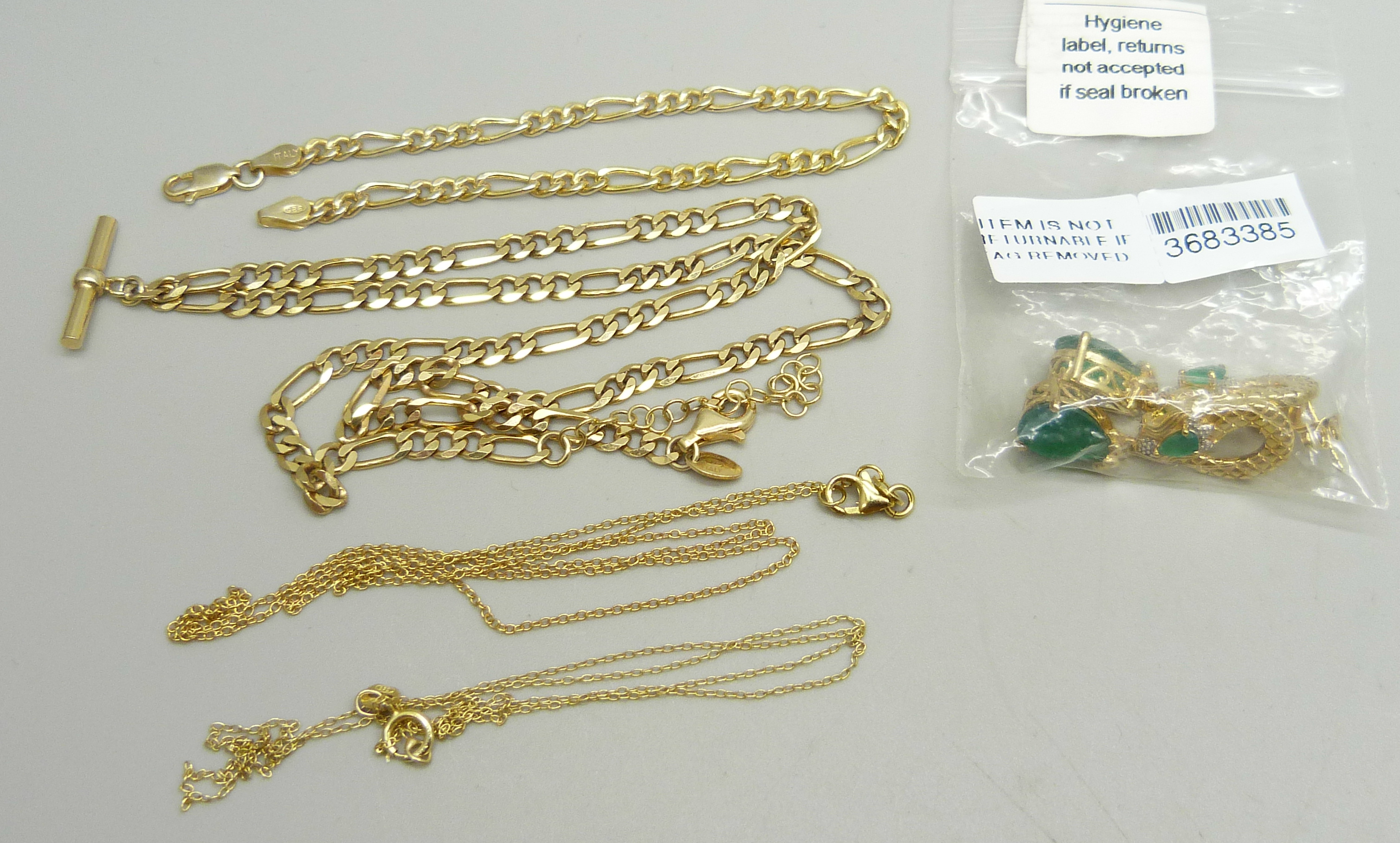 A silver gilt figaro chain with T bar, a silver gilt figaro bracelet, two silver gilt chains and a