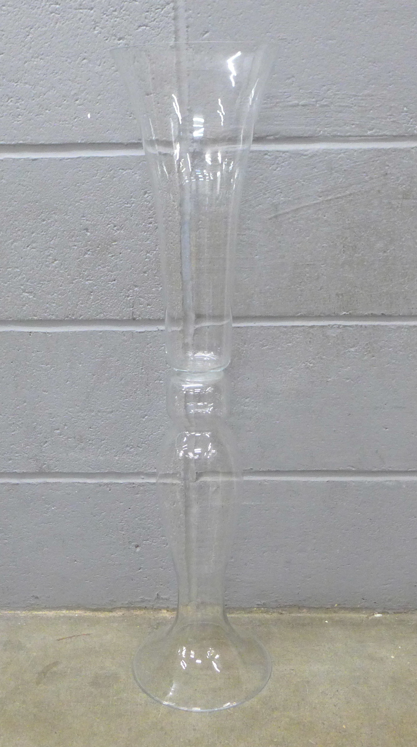 A tall glass vase, 80cm **PLEASE NOTE THIS LOT IS NOT ELIGIBLE FOR IN-HOUSE POSTING AND PACKING**