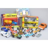 Two WhizzWheels F1 cars, boxed, other F1 cars, Barton Toys Garage accessories, etc.