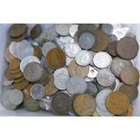 A box of mixed British and foreign coinage