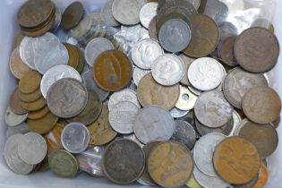 A box of mixed British and foreign coinage