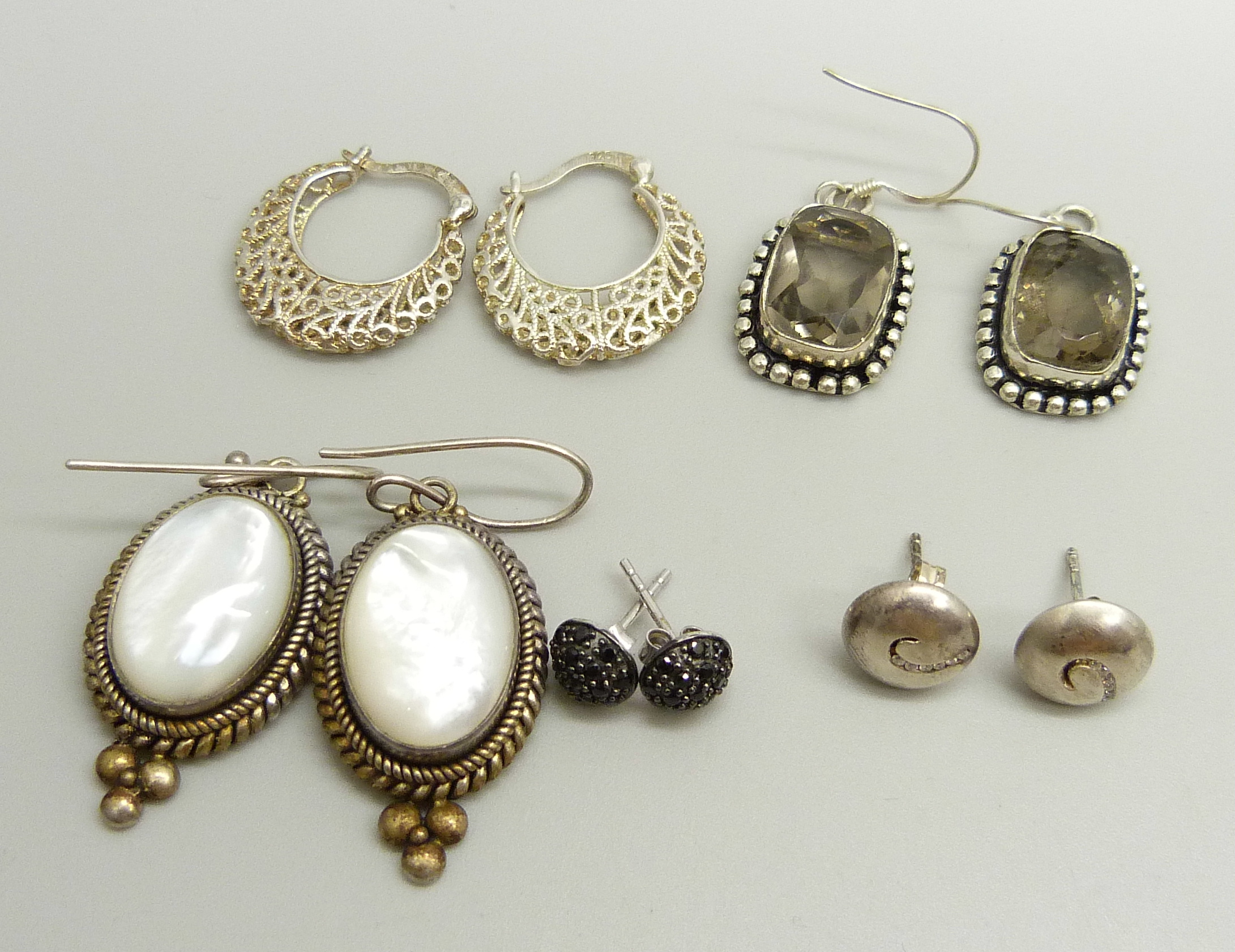 A pair of Suati silver and mother of pearl drop earrings, a pair of white metal stone set earrings