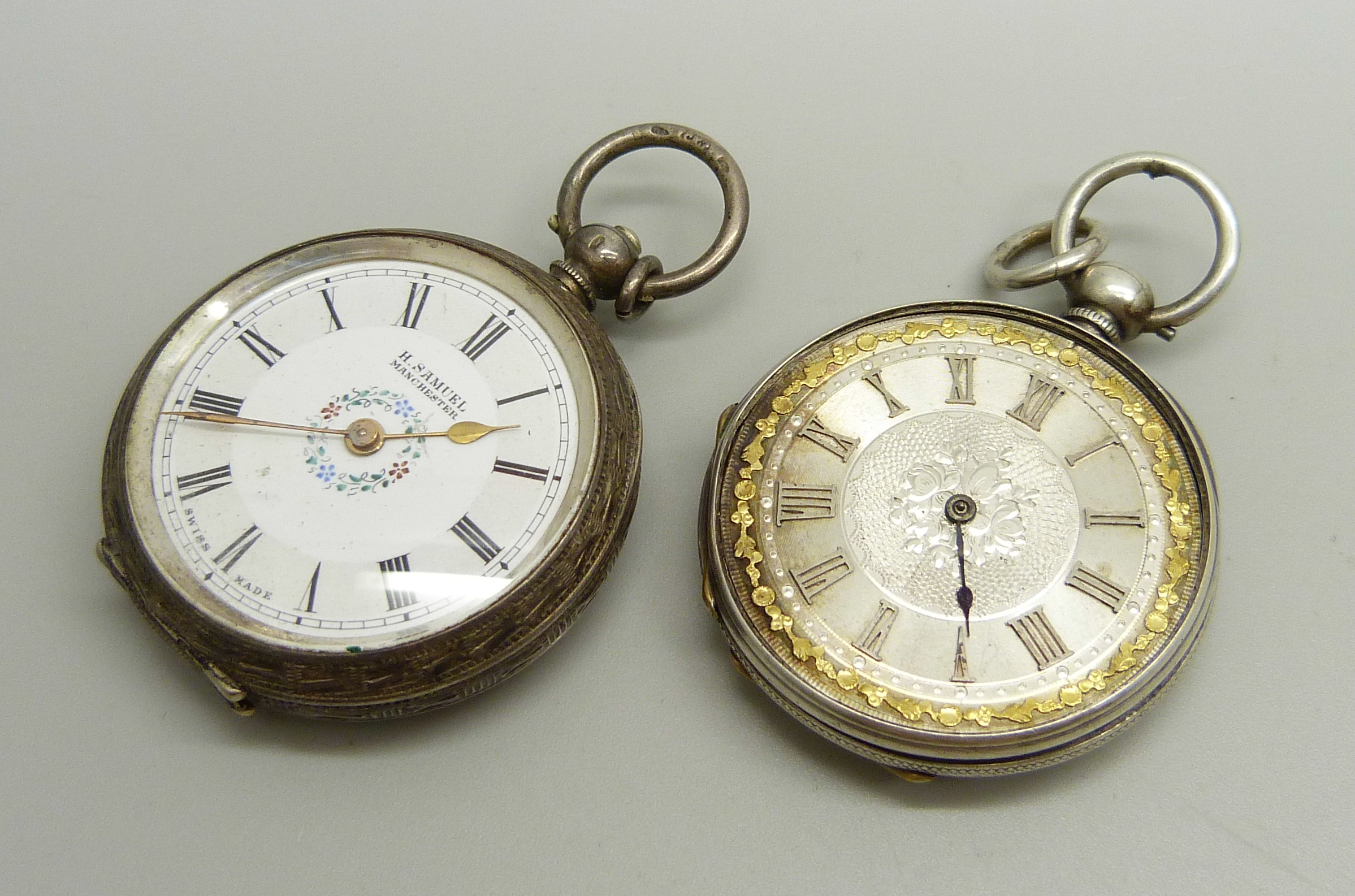 A .935 silver cased H. Samuel fob watch and a white metal cased fob watch (lacking glass and hand