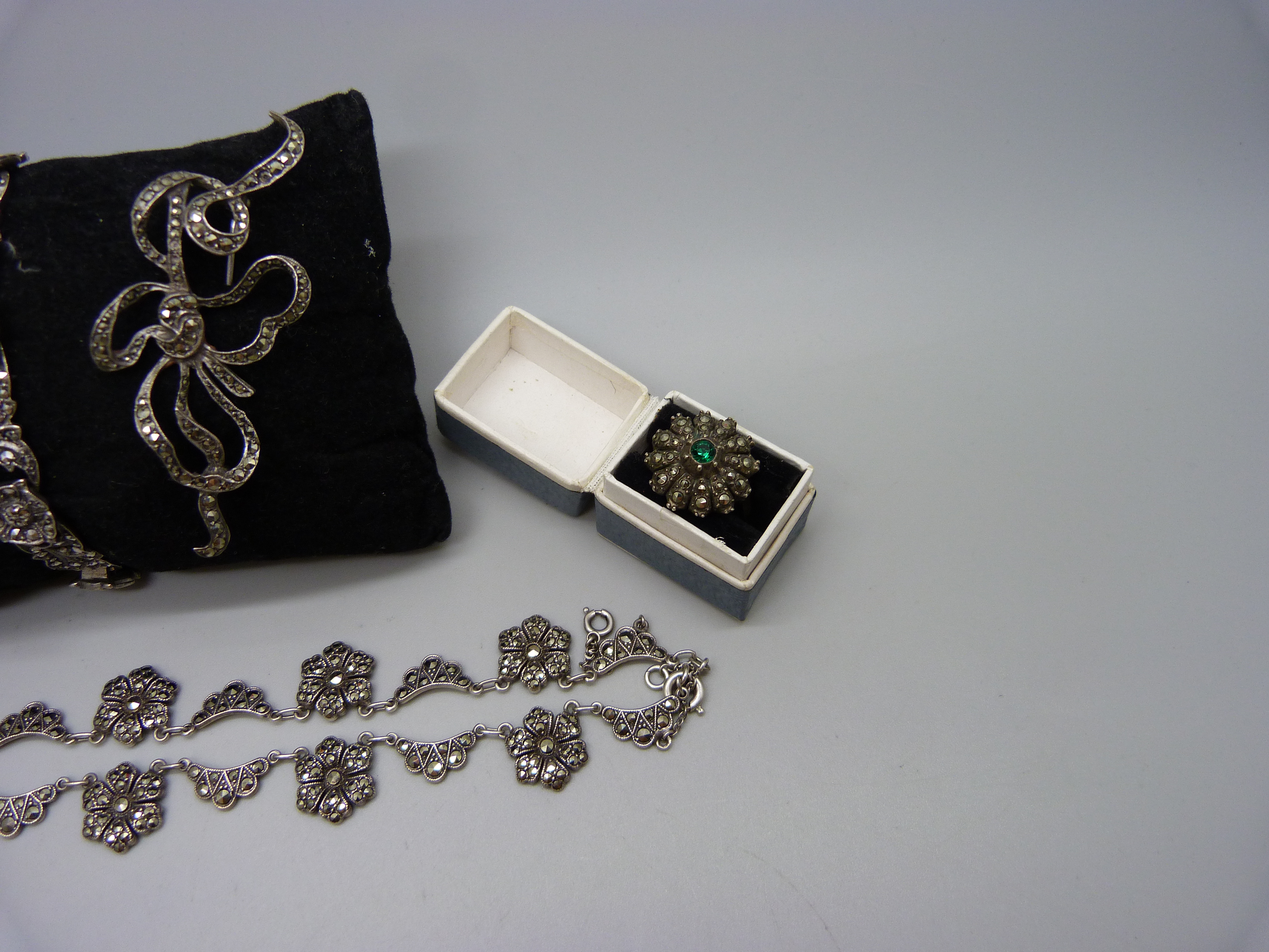 A collection of silver and marcasite jewellery; a necklace (missing one stone), a .800 ring, two - Image 4 of 4