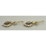 A pair of yellow metal drop earrings set with white and dark blue stones, approximately 3.6cm drop