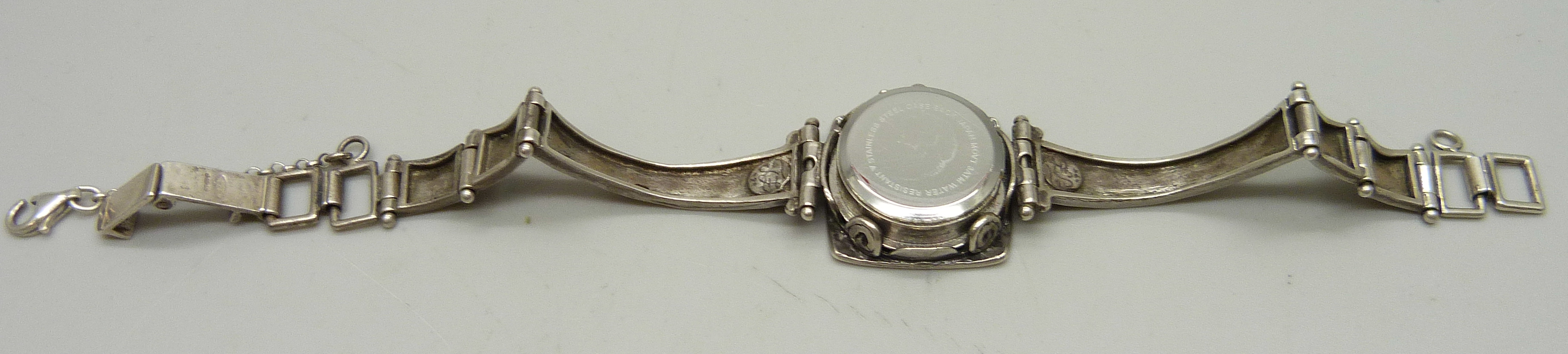 A lady's silver wristwatch with hammered design bezel and strap, hallmarked on the clasp with - Image 4 of 4