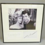 An Olivia Newton-John and John Travolta Grease autograph display Rutland Antiques AFTAL registered