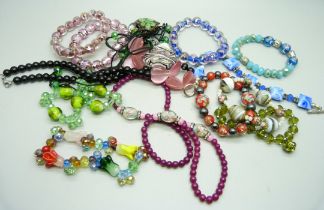 Ten glass bead and other bracelets and three necklaces