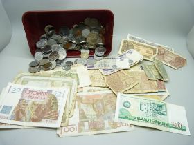 A collection of coins and bank notes