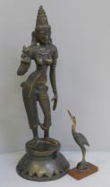 A bronze model of an Indian Goddess, Parvati Devi and a horn and rosewood model of a bird