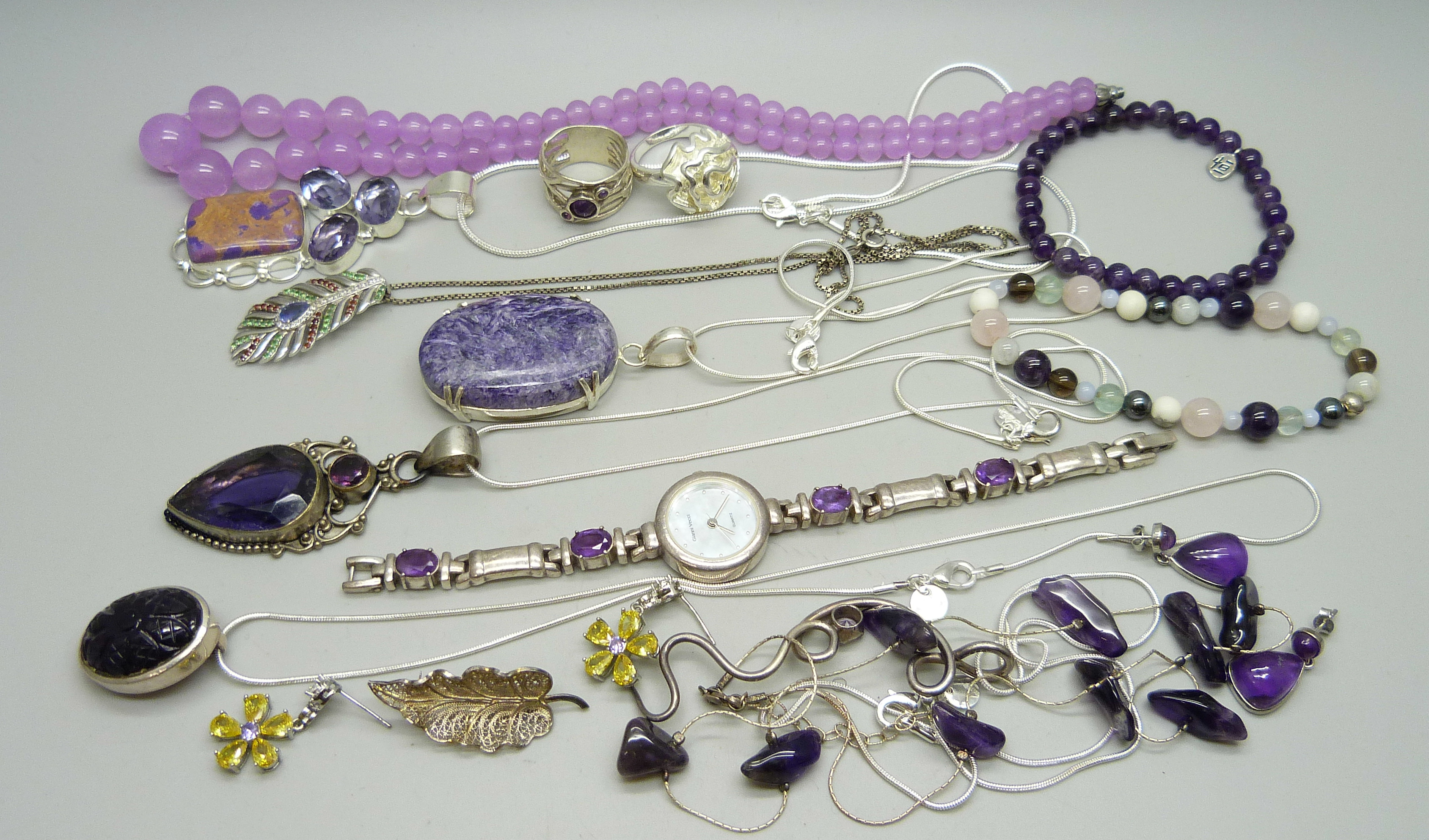 A collection of silver and white metal stone set jewellery including a silver wristwatch set with