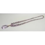 A faceted amethyst bead necklace, the bale marked 9ct, with a base metal clasp, 4.6cm pendant